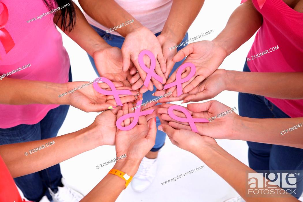Stock Photo: healthcare, people and medicine concept - close up of women hands with cancer awareness ribbons over white background.
