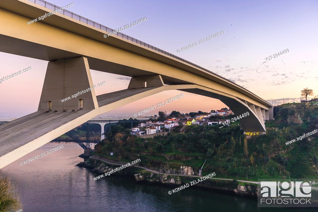 Stock Photo: Infante D. Henrique Bridge over Douro River between Porto and Vila Nova de Gaia cities, Portugal. Old and new railway bridges seen on background.