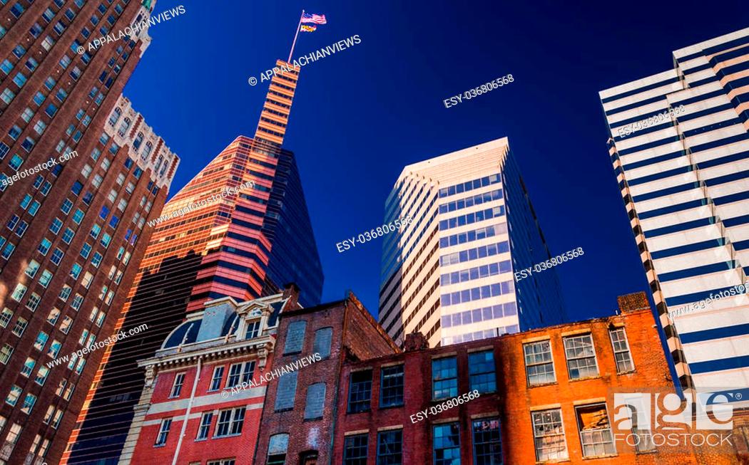Stock Photo: Looking up at a mix of modern and old buildings in Baltimore, Maryland.