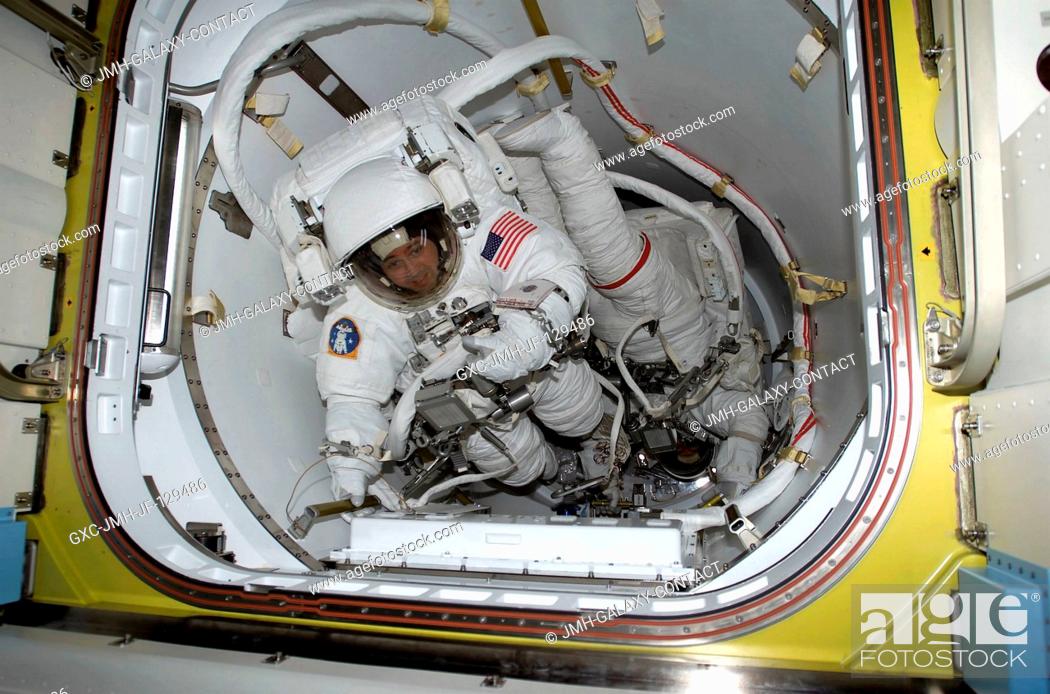 Stock Photo: Astronauts Daniel W. Bursch (left) and Carl E. Walz are photographed in the crew lock of Quest prior to the February 20 space walk.