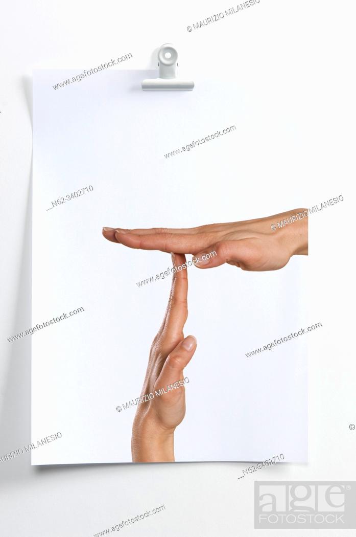 Stock Photo: Blank sheet hanging on the wall with image of hands indicating break time.