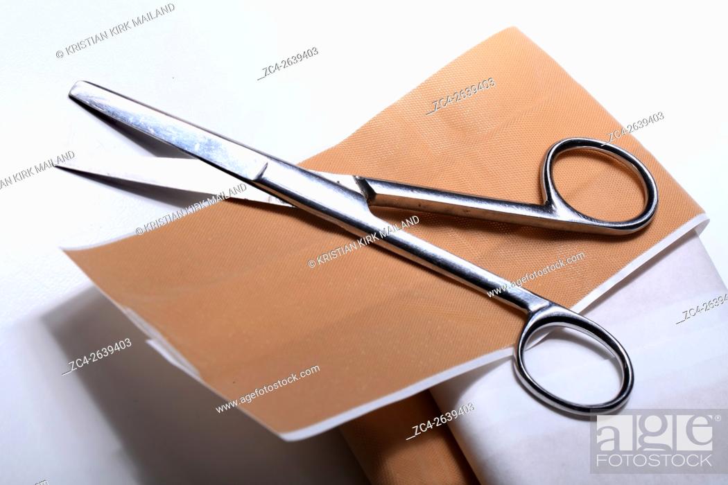 Stock Photo: First aid: Path and scissors.